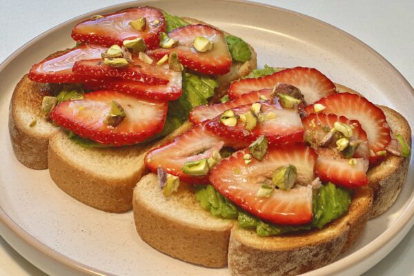 Strawberry Avocado Toast with Pistachios and Maple Syrup